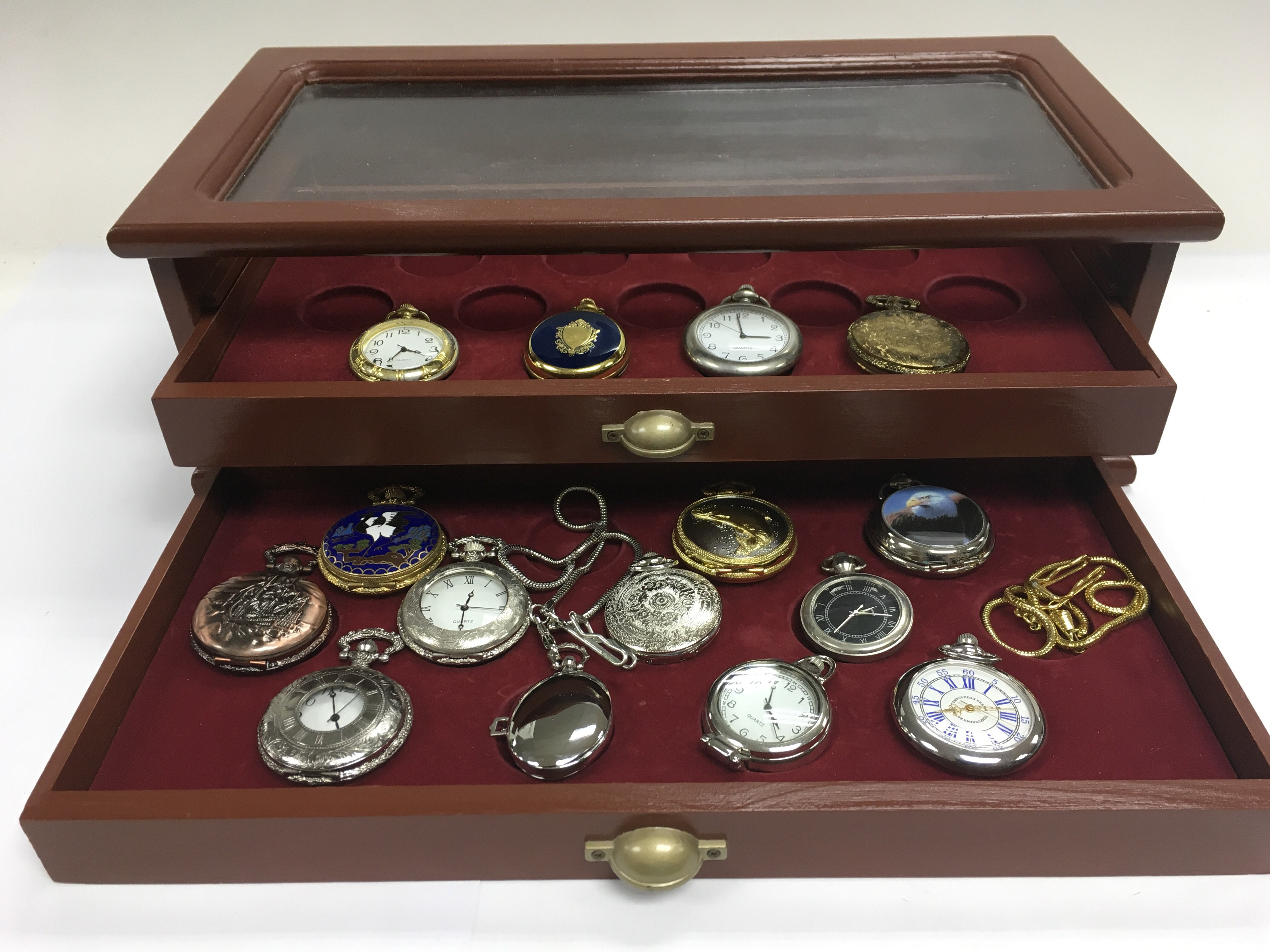A display case containing various pocket watches.