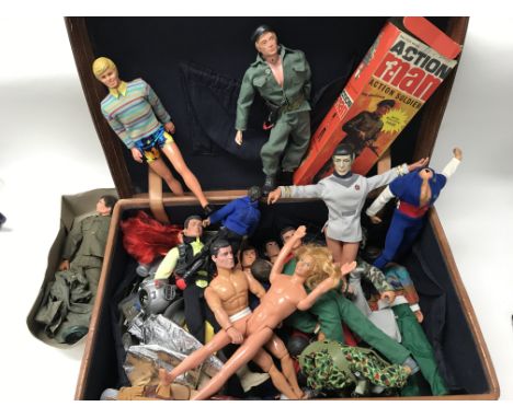 A collection of Action Man dolls including accessories.