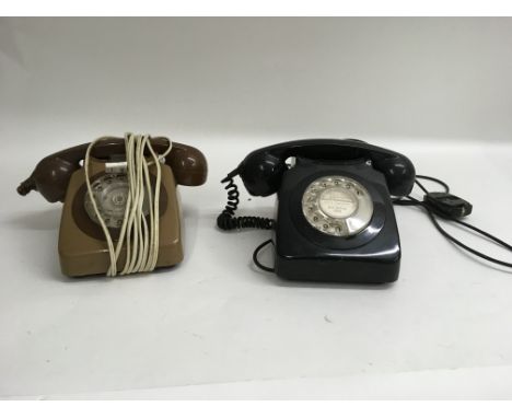 A pair of rotary telephones, one registered for south benflert use and the other being issued by BT Southend.