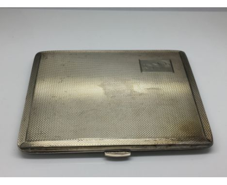 A silver cigarette case with engine turned decoration, Birmingham hallmarks.