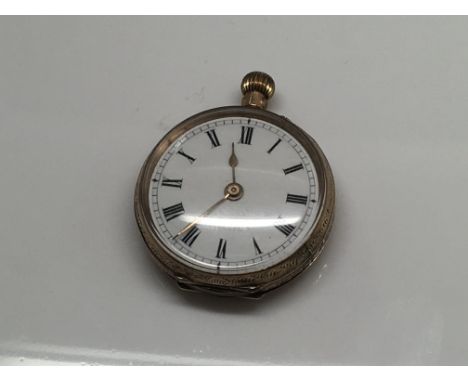 An Edwardian 9 ct gold fob watch the enamel dial with Roman numerals