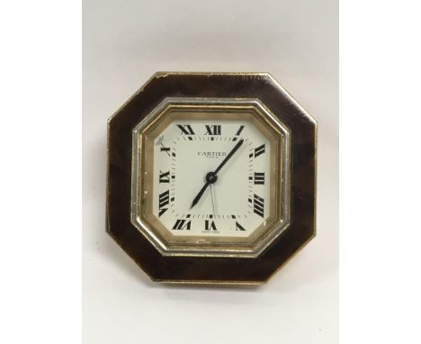 A Cartier octagonal desk clock (missing bracket).