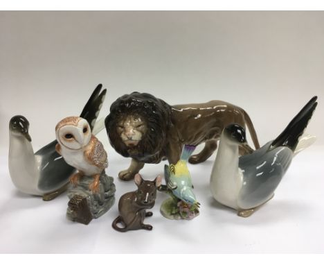 A pair of Lomonosov figures of doves, a Beswick owl and other ceramic animals.