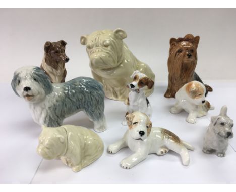 A collection of nine ceramic figures of dogs including Royal Doulton and Sylvac examples.