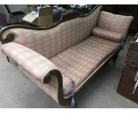 A William IV mahogany Gillows design sofa with shaped back and raised on fluted legs, approx 212cm wide.