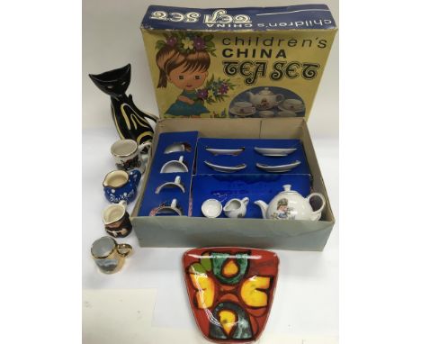 A vintage boxed child's tea set, a Poole dish and other ceramics.