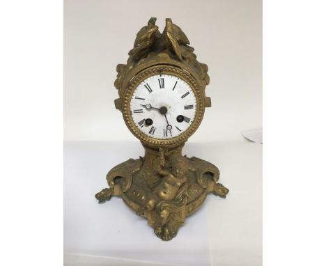 A box of clock parts including a gilt metal mantle clock