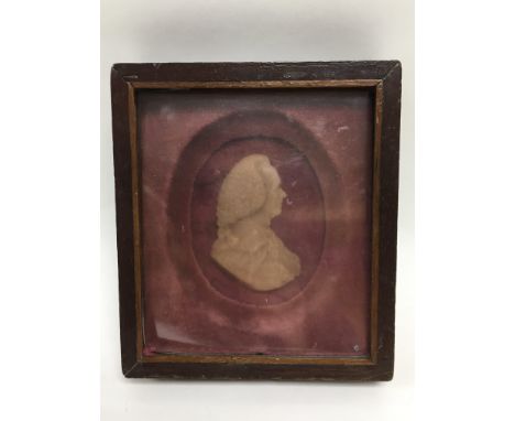 An 18th Century wax silhouette portrait, frame measures approx 15.5cm x 17.5cm.