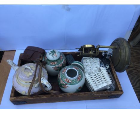 A collection of oriental China and ceramic alongside an uncashed dome clock and a Halina camera