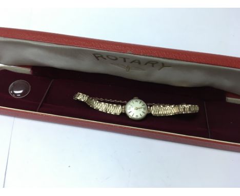 A boxed 9ct gold ladies Rotary wrist watch with spare glass face.. Weight approx