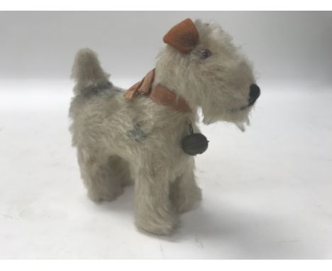 A small Steiff figure of a Fox Terrier. Length approx 11.5cm