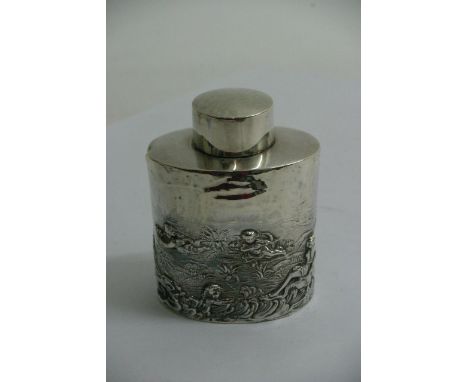 A Silver oval tea caddy decorated with cherubs, Chester hallmarks 1898.