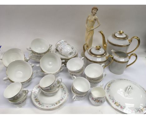 A three piece tea service in white and gilt, a Royal Doulton figure 'Cherished Memories' and a part tea service with transfer