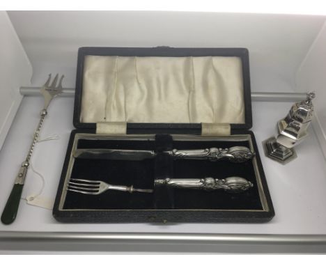 A cased silver knife and fork set, a/f, a silver sifter and fork