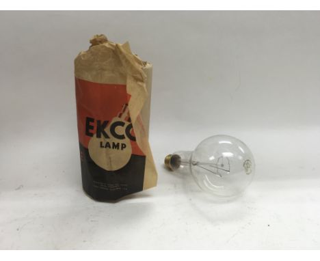 An Ekco radio together with two boxes containing original Ekco lamp bulbs.