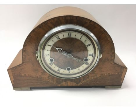 A walnut mantle clock