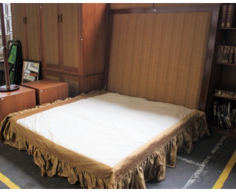 A pair of single divan beds, forming a double bed, with headboard.