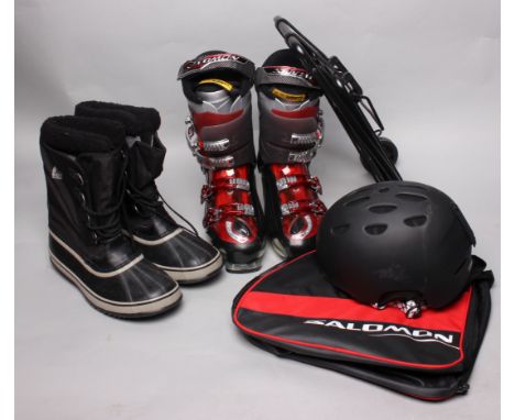 Skiing and snowboarding equipment, including: a pair of Salomon 'Energyser 100' ski boots, size 29.0, a Pro-Tek helmet size X