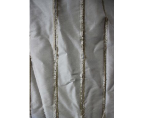 A pair of lined full-length beige curtains with vertical pleats, drop approx. 300cm. 