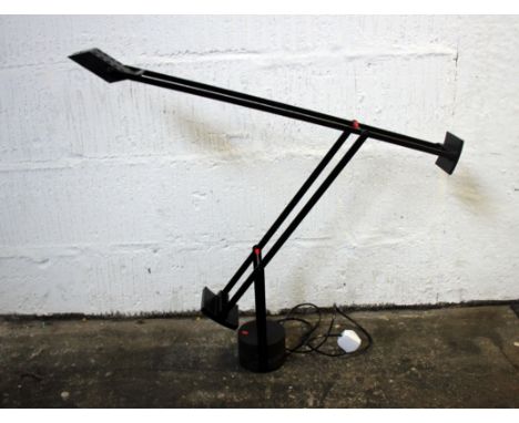 A modern black cantilever adjustable desk lamp. 