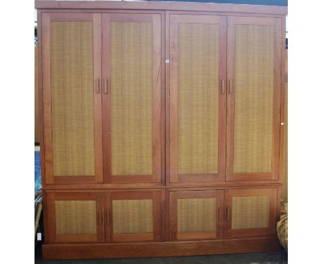 A Continental light wood four-door wardrobe, 230cm wide; together with a matching three-drawer chest, 110cm (2)