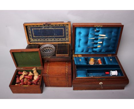 A Regency mahogany tea caddy, early 19th Century, of sarcophagus form raised on brass ball and claw feet opening to reveal tw