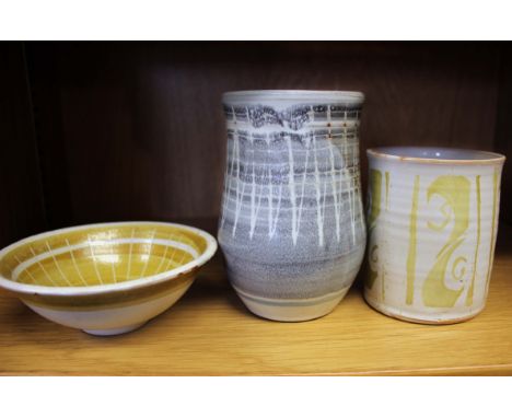 Three pieces of studio pottery by Alan Caiger-Smith to include a mug with gold lustre decoration, a vase and a small footed b