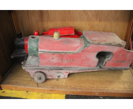 A scratch built red painted model of a steam engine, together with another (lacking wheels) (2)
