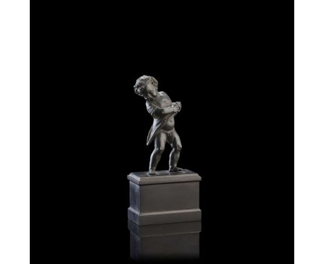  FLORENTINE BRONZE FIGURE OF A PUTTO LATE 18TH/ EARLY 19TH CENTURY black/green patina, on a rectangular black marble plinth F