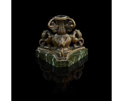  A PADUAN OR VENETIAN BRONZE CANDLESTICK 16TH CENTURY the acanthus cast baluster stem on a triform base with satyr headed gro
