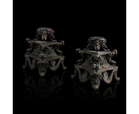  A PAIR OF ITALIAN BRONZE TRIPOD STANDS 19TH CENTURY in the 16th century style, dark brown/black patina, the upper tiers on t