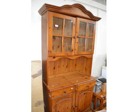 Pine dresser with glazed door above, drawers and cupboard below approx 88 cm wide 