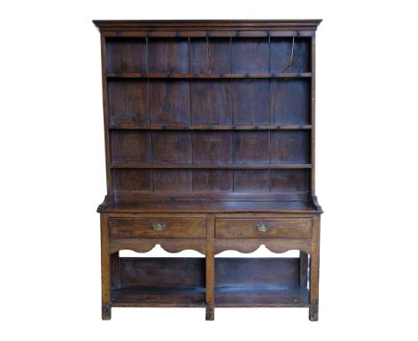 Late 18 th century oak dresser, moulded cornice with three fixed shelves to rack, base with two plank top above two frieze dr