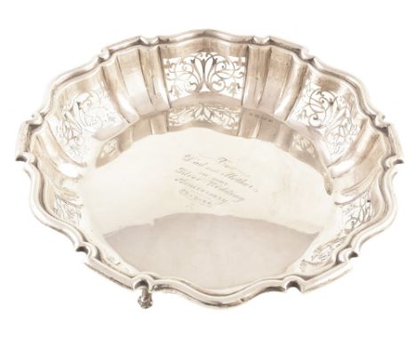 Silver presentation dish , Chippendale border with pierced floral decoration on 3 paw feet, engraving to centre 'To Dad and M