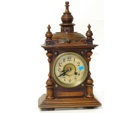 Small Victorian 8-day mantel clock with turned finials and stepped decoration to top. Condition reports are not available for