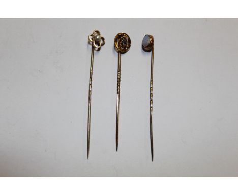 An antique 15ct gold and blue topaz pin, 1.2gms; and an opal and seed pearl similar (tested as 9ct gold)