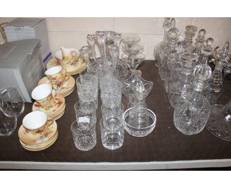 A quantity of various table glassware to include cut glass tumblers, vine etched Champagne saucers, five light candelabra, fr