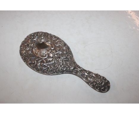 An embossed silver hand mirror, Birmingham 1910