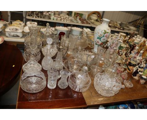 A large quantity of cut and other glassware to include ice buckets, punch bowl, large opaque glass vase decorated with bords 