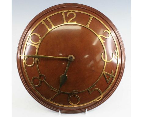 An Art Deco Zenith walnut and brass mounted convex wall clock, having Arabic dials with proud numbers and minute outer scale,