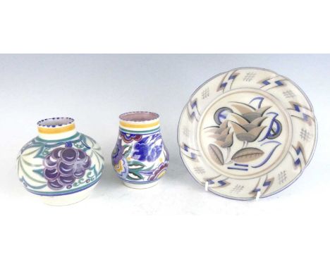 Two similar 1930s Poole pottery squat vases, one of bulbous form decorated with grapes, impressed marks verso, h.12.2cm; the 