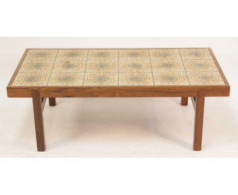 A 1960s Danish rosewood and tile top inset rectangular coffee table by Oxart for Trioh, the stylised flower head tiles raised