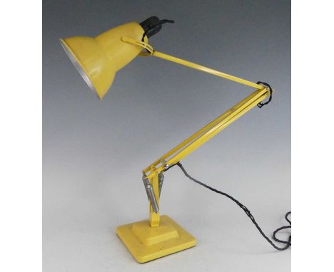  Herbert Terry - a yellow painted metal anglepoise lamp, model No.1227, of hinged and rotating form with moveable shade, rais