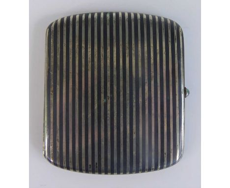 An early Art Deco silver niello pocket cigarette case, the exterior with striped decoration, cabochon sapphire inset button c