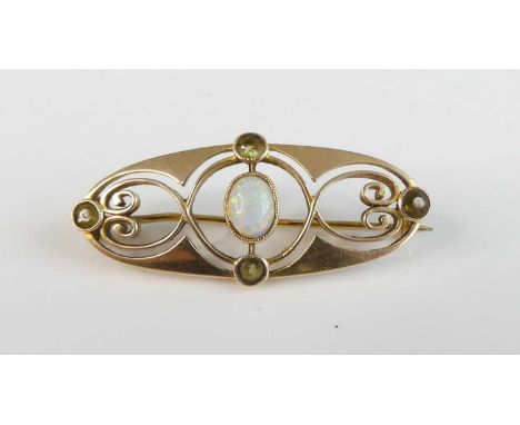 Murrle Bennett Company - an Art Nouveau 15ct gold, opal and peridot brooch, of oval pierced and stylised form, stamped 'MBC 1