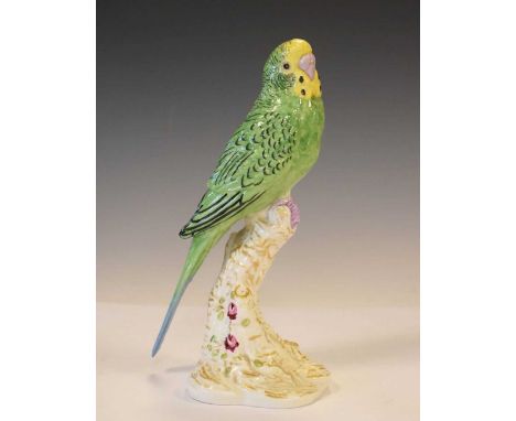 Royal Worcester yellow and green budgerigar raised to a white gilt and floral painted branch, model 2663, 18cm high 