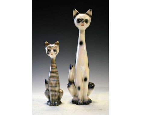 Two mid-20th Century Dutch pearl lustre ceramic cats, 37cm high and smaller
