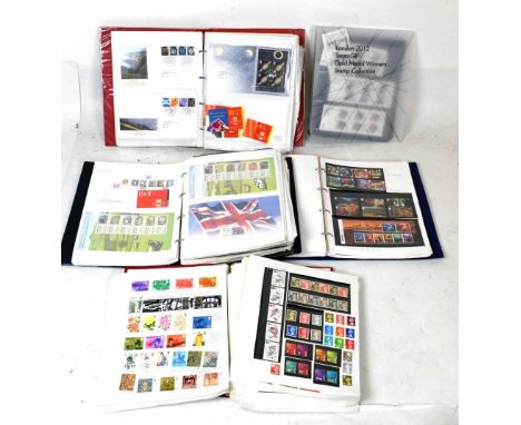 Four albums of Queen Elizabeth II GB postage stamps, covering the mid 20th Century to present day, including Post &amp; Go, P