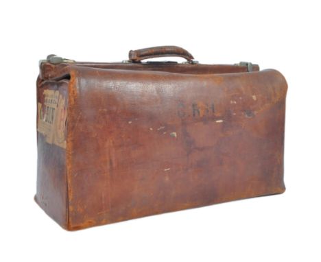 c1930s calf leather holdall, with torn labels denoting (P.) &amp; C. S. N. Co., with the label of the&nbsp;Peninsular &amp; O