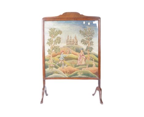 An early 20th century mahogany framed decorative embroidered needlepoint fire screen on cabriole supports. The needlepoint de